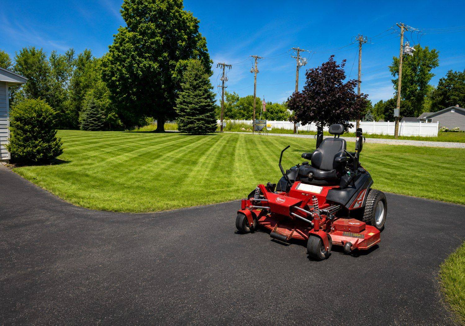 Commercial lawn maintenance with professional zero-turn equipment